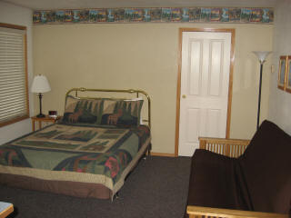 Main room with queen bed and double futon